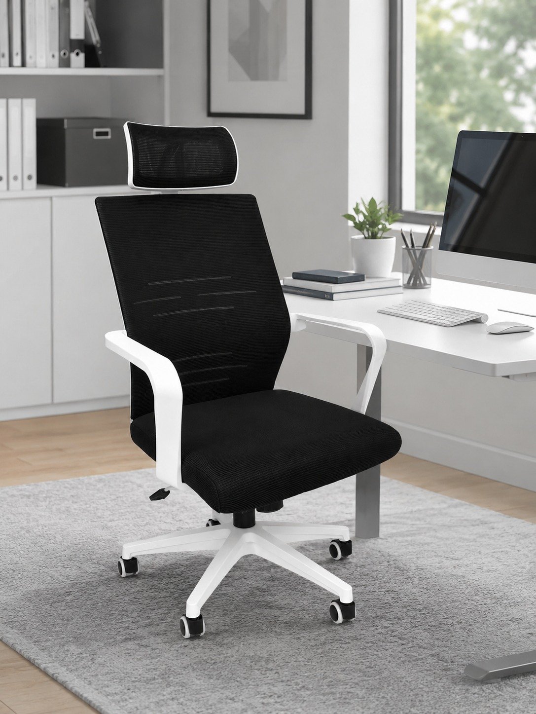 Black and white mesh ergonomic office chair with adjustable headrest