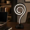 Modern black spiral LED table lamp with white light