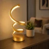 Modern gold spiral LED table lamp with warm white light