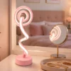 Modern pink spiral LED table lamp with white light