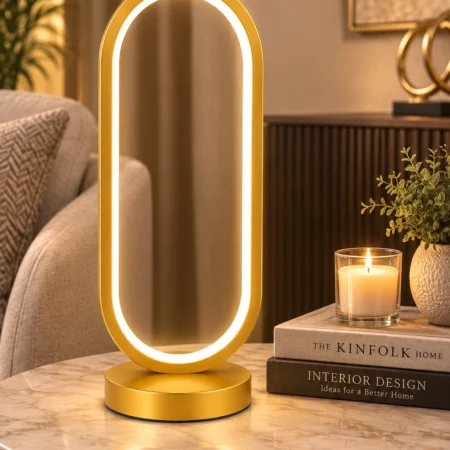 Modern gold LED arch table lamp with warm ambient light