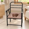 Portable commode chair with brown seat and black frame