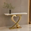 Modern gold console table with marble-look top