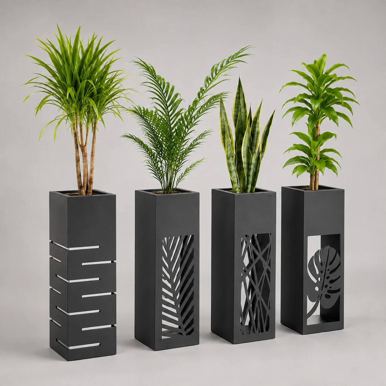 Tall black decorative planters with geometric and leaf cutout designs
